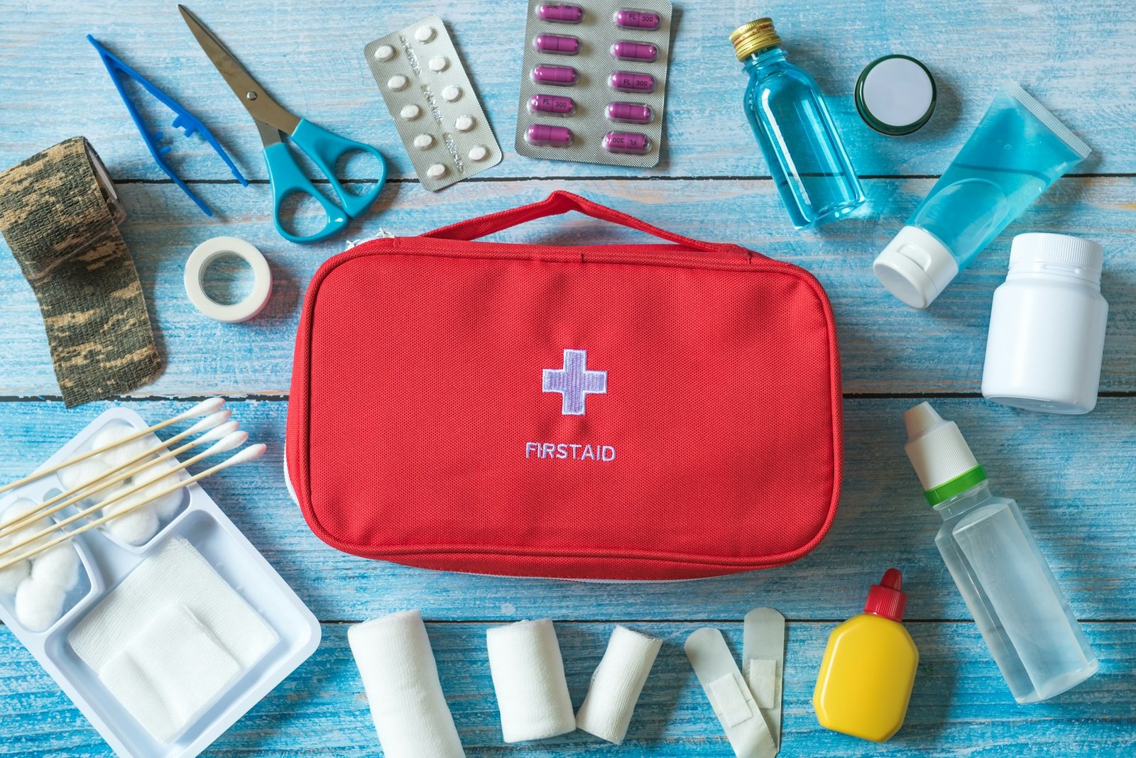 First aid kit with medical equipment and emergency objects at home or travel set